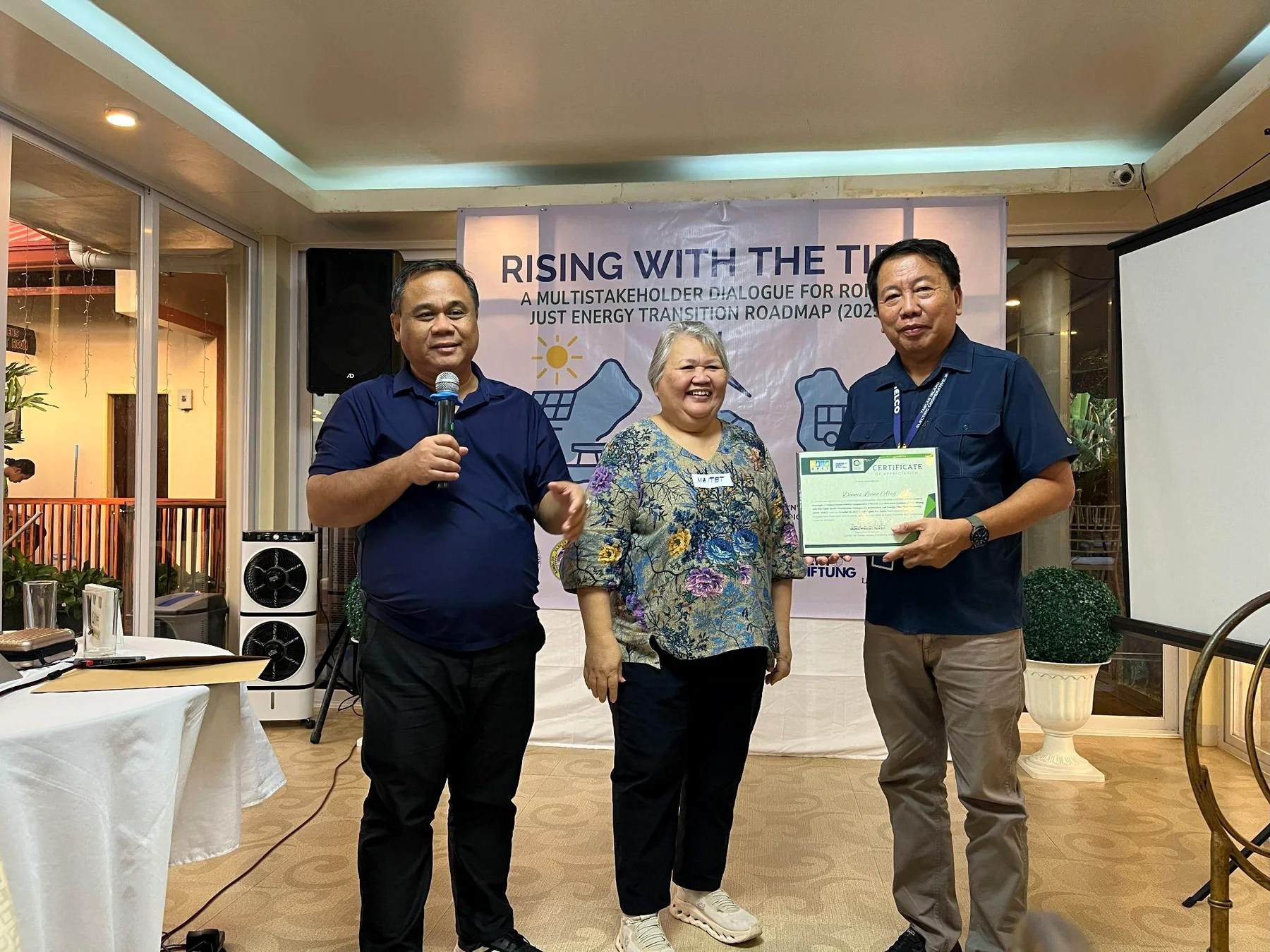 Maitet Diokno and Wilson Fortaleza with the TIELCO general manager